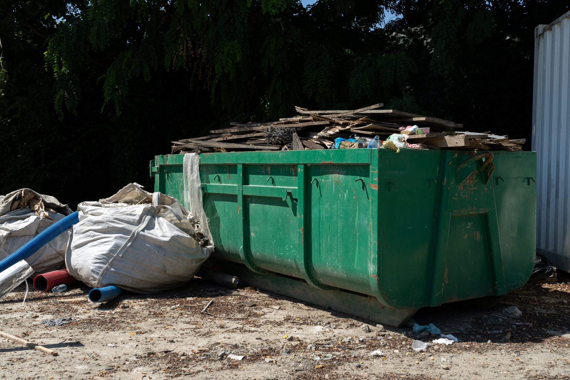 Rectangular open top roll off dumpster. Hook lift container for garbage truck.